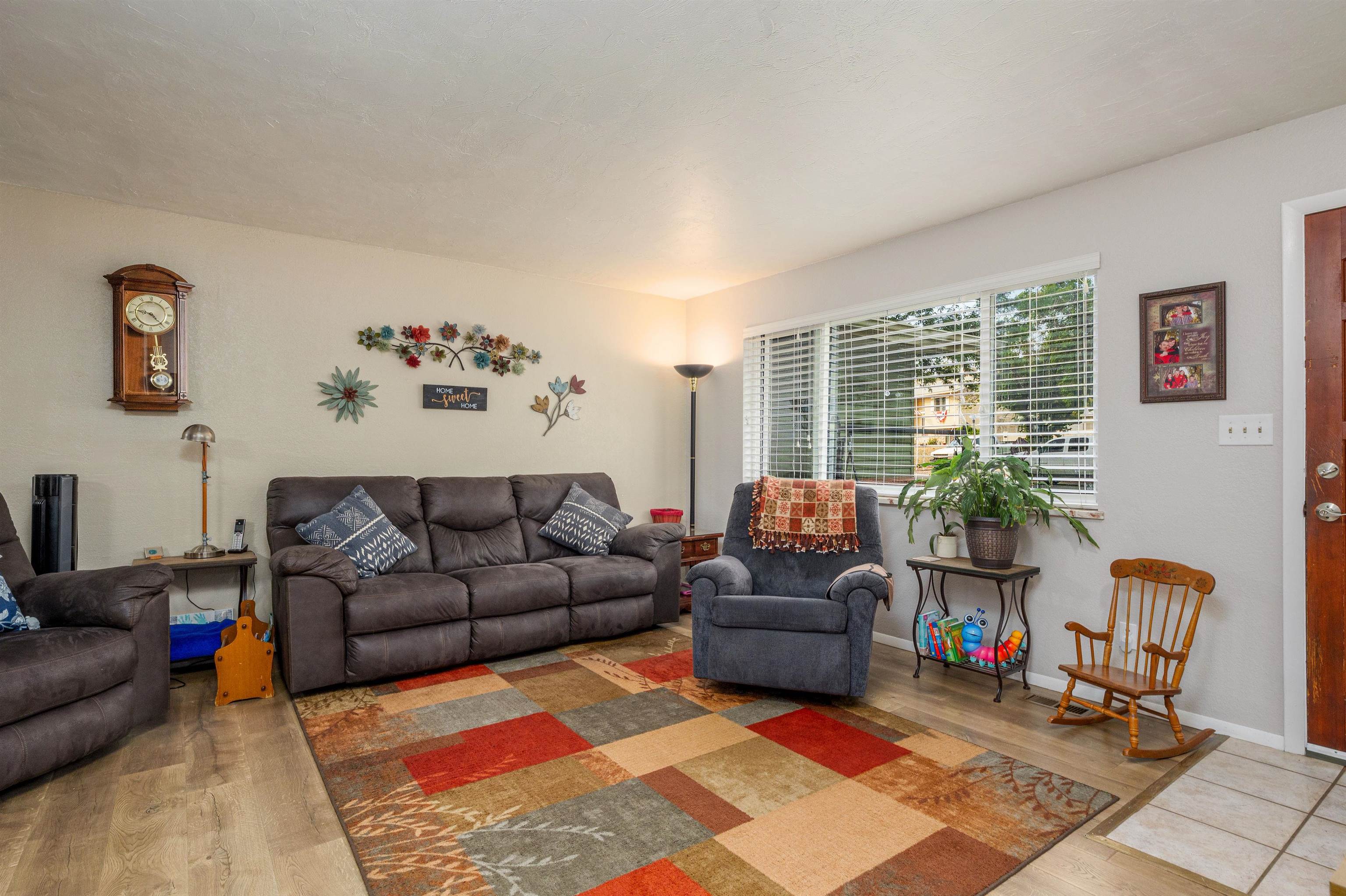 2706 Rincon Drive Grand Junction, CO 81503 - Photo 7 of 42 a living room with furniture and a rug