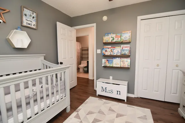 a bedroom with furniture and a window