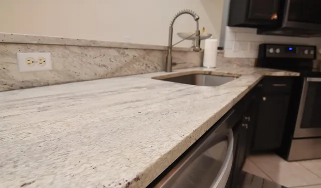 a kitchen with a sink and cabinets