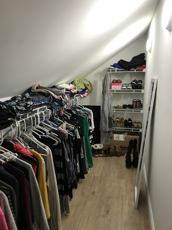 92 Howland Road Fairhaven, MA 02719 - Photo 11 of 27 a view of walk in closet with clothes and shoes