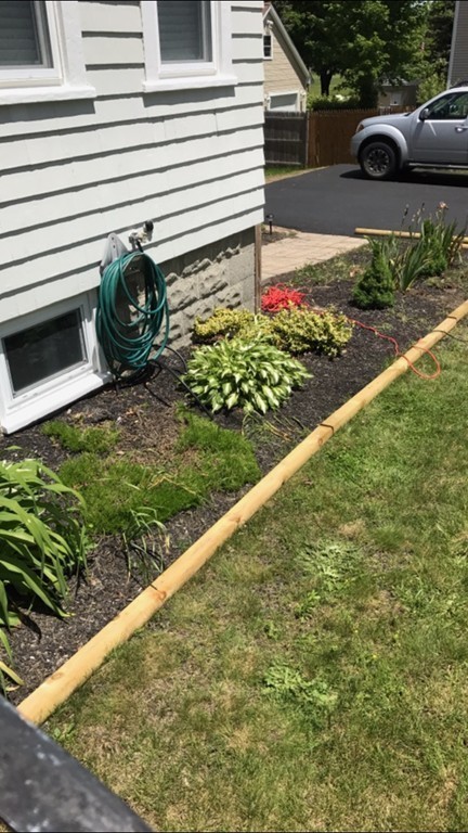 92 Howland Road Fairhaven, MA 02719 - Photo 18 of 27 a front view of a house with garden