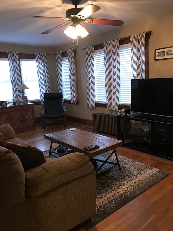 92 Howland Road Fairhaven, MA 02719 - Photo 3 of 27 a living room with furniture and a flat screen tv