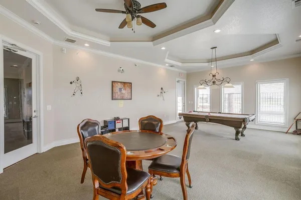 a dining room with furniture and window