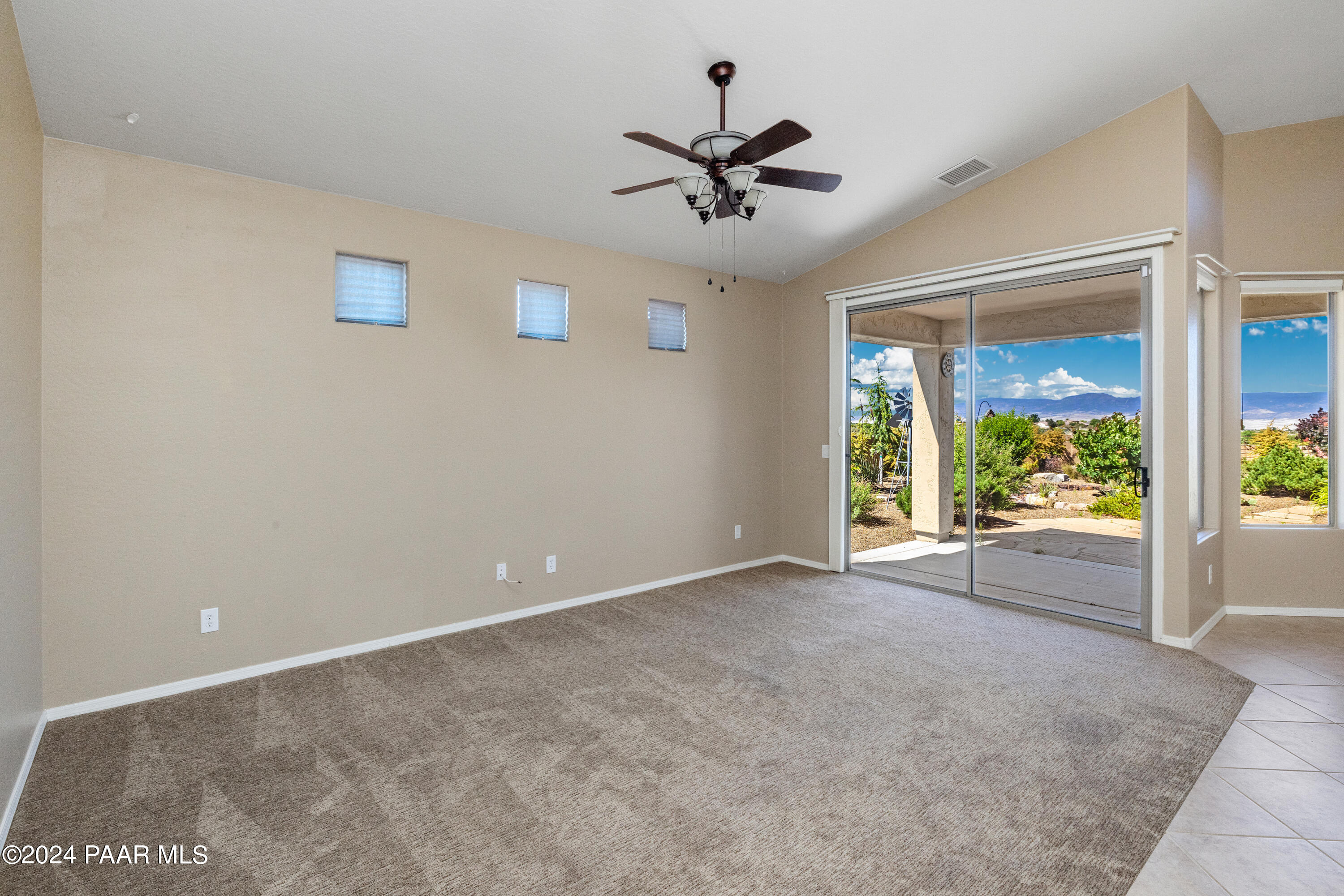 1195 Rigo Ranch Road Prescott Valley, AZ 86314 - Photo 3 of 65 a view of a livingroom with a ceiling fan and window