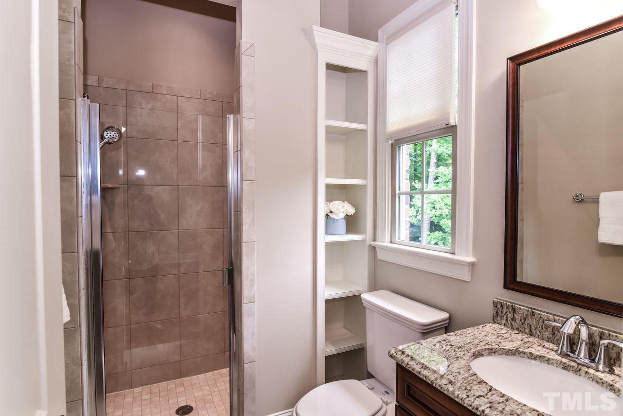 6924 Mactavish Way Raleigh, NC 27613 - Photo 11 of 30 Full bathroom attached to guest bedroom on main floor.