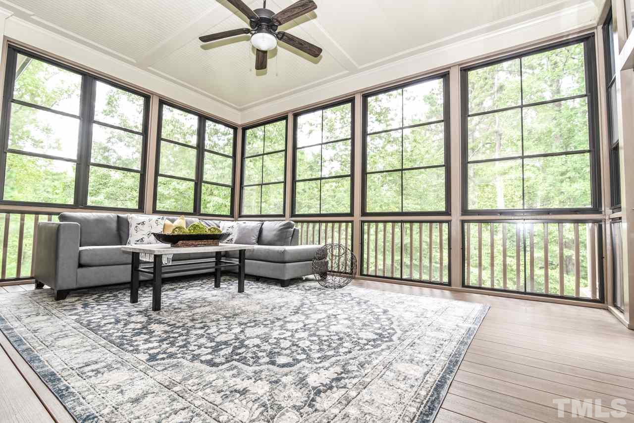 6924 Mactavish Way Raleigh, NC 27613 - Photo 14 of 30 Enclosed porch with Eze-Breeze windows - can be removed for regular screened-in porch.