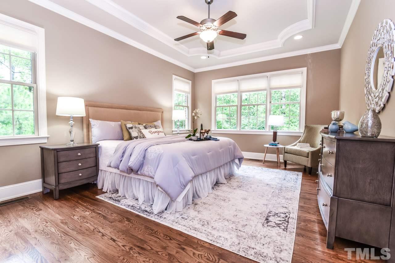 6924 Mactavish Way Raleigh, NC 27613 - Photo 15 of 30 Large first floor master bedroom! Beautiful wooded views.