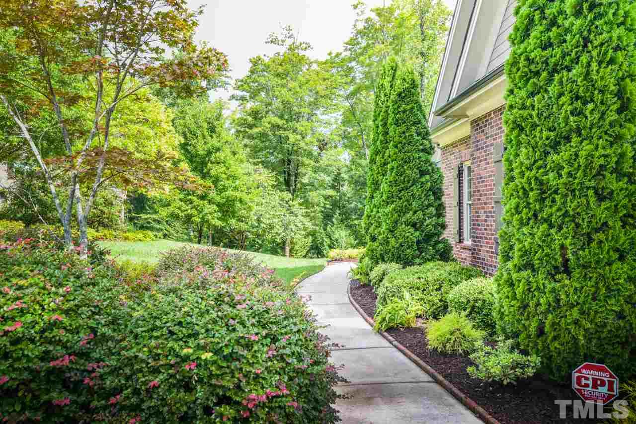 6924 Mactavish Way Raleigh, NC 27613 - Photo 3 of 30 Beautifully landscaped and impeccably maintained with an irrigation system.