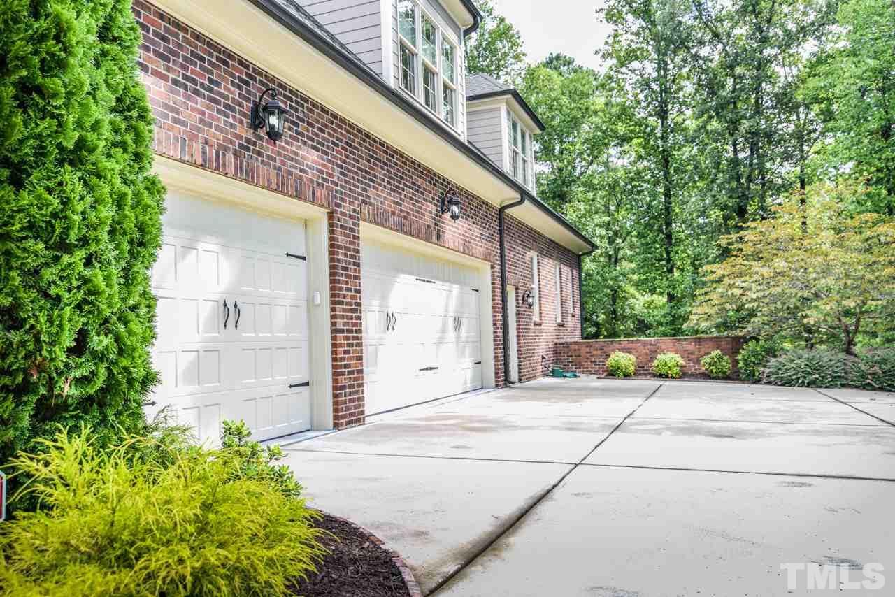 6924 Mactavish Way Raleigh, NC 27613 - Photo 25 of 30 2 car and 1 car garage with extra storage space.