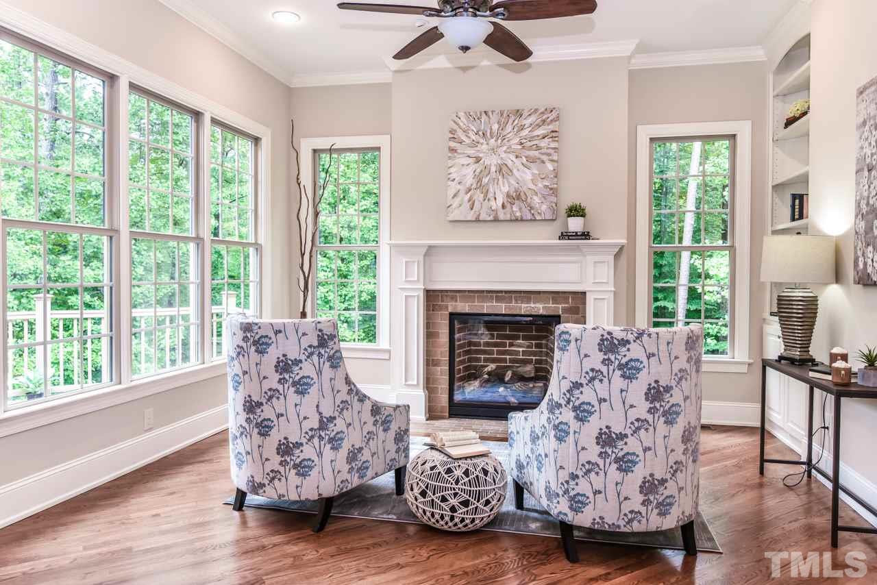 6924 Mactavish Way Raleigh, NC 27613 - Photo 10 of 30 Sitting area off of the kitchen - built-ins make for a great library.