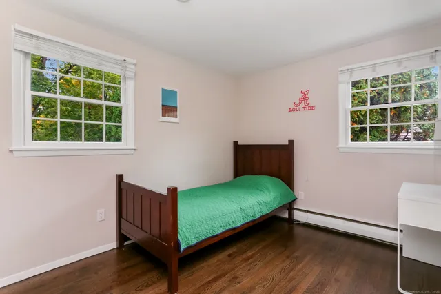 a room with a bed and a window