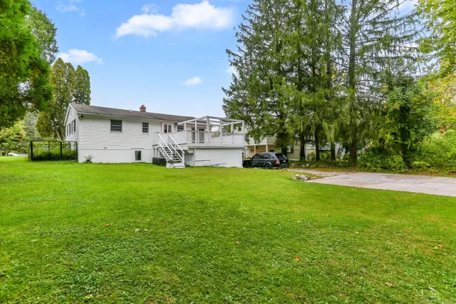 a view of a house with a big yard