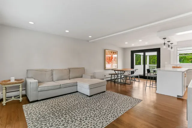 a living room with furniture and a table
