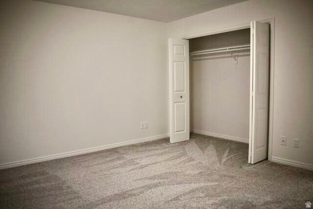 778 North 250 West Springville, UT 84663 - Photo 12 of 16 Unfurnished bedroom with light colored carpet and a closet