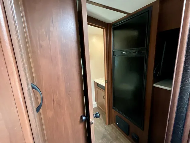 a bathroom with a glass door shower and sink