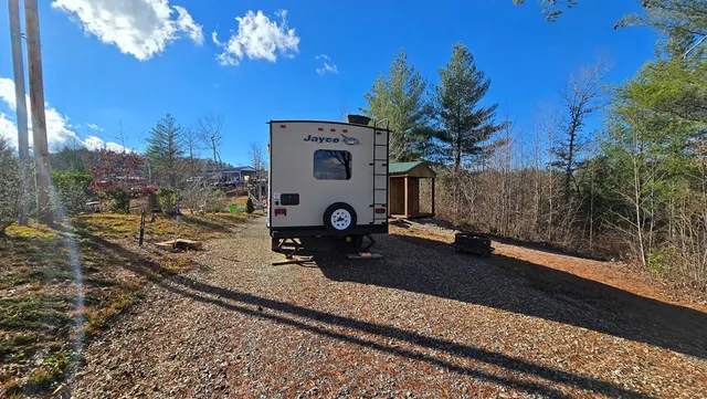 a backyard view with a table and chairs
