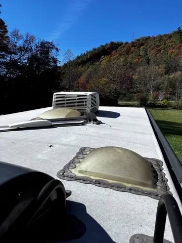 a kitchen with a sink and wooden floor