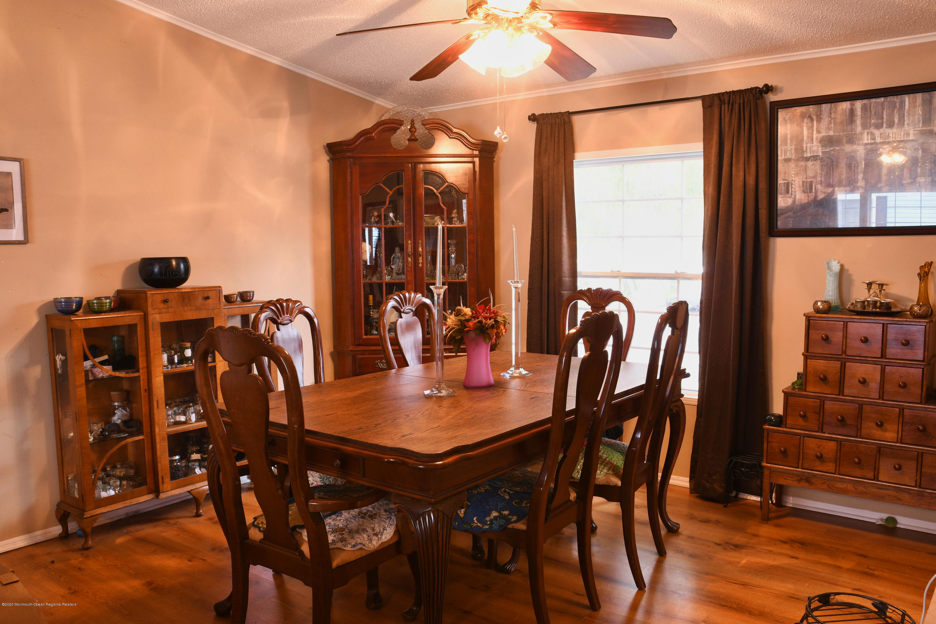 46 Village Road Morganville, NJ 07751 - Photo 5 of 16 a view of a dining room with furniture and chandelier