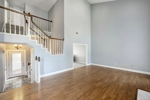 a view of an entryway with wooden floor