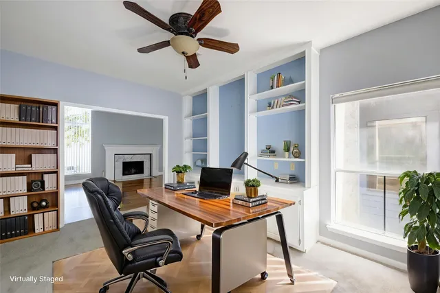 a workspace with furniture and a window