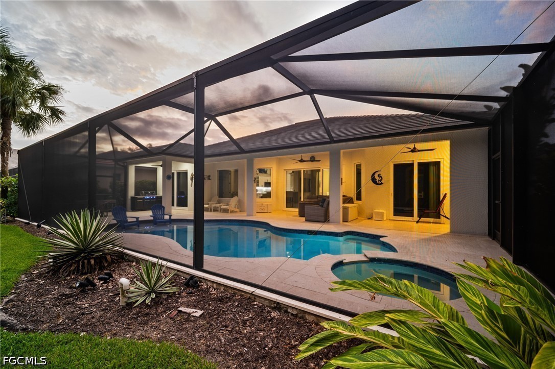 9042 Bronco Court Naples, FL 34113 - Photo 33 of 50 a front view of house with a garden