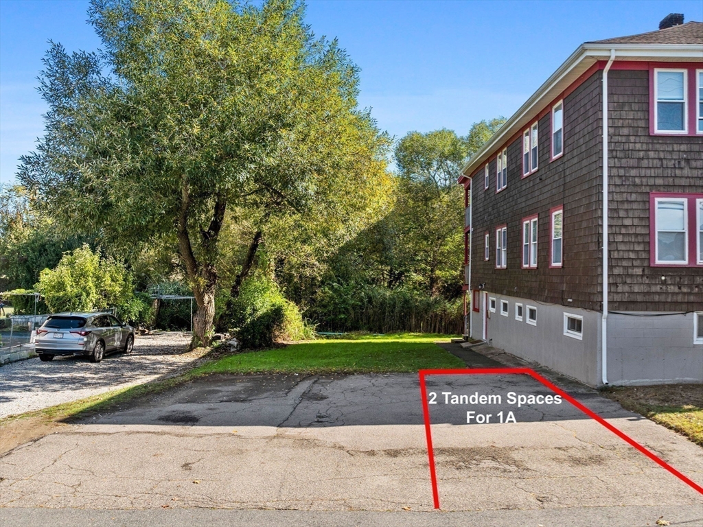 134 Newbury Avenue, Unit 1A Quincy, MA 02171 - Photo 7 of 13 a front view of a building with garden