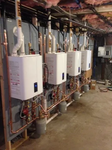 a bedroom with a bed and a flat tv screen on a dresser