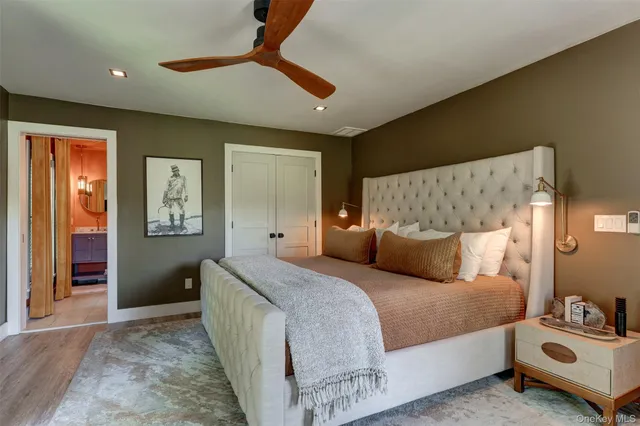 a bedroom with a bed and a walk in closet