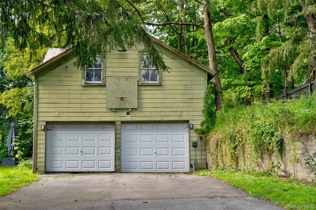 a front view of a house with a garage