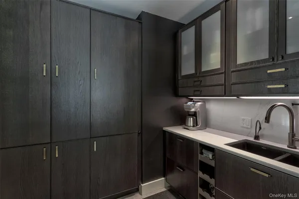 a kitchen with a refrigerator and cabinets
