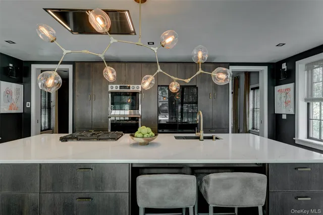 a kitchen with a table and chairs