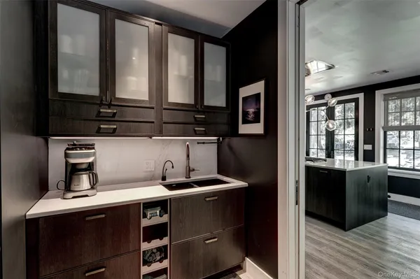 a kitchen with a sink cabinets and window