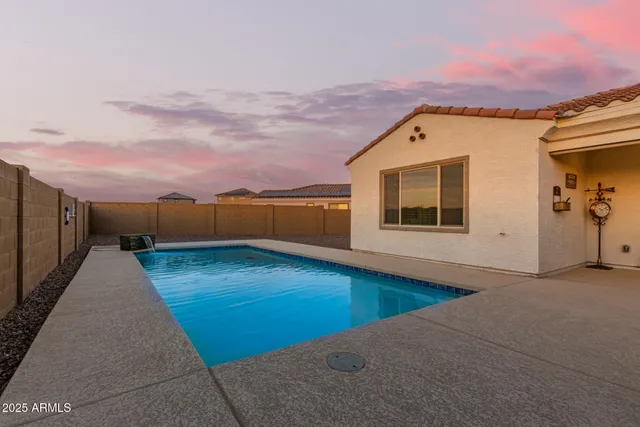 a bathroom with a granite countertop toilet a sink and a mirror