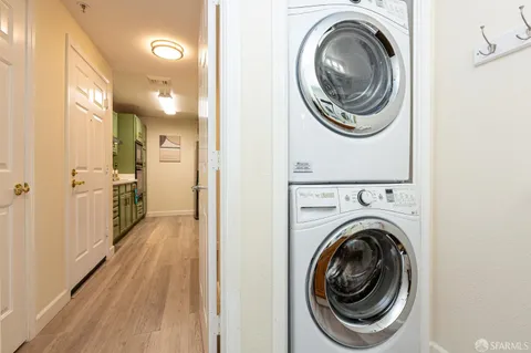 a view of a hallway with washer and dryer