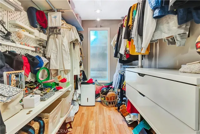 a bathroom with a double vanity sink a mirror and shower