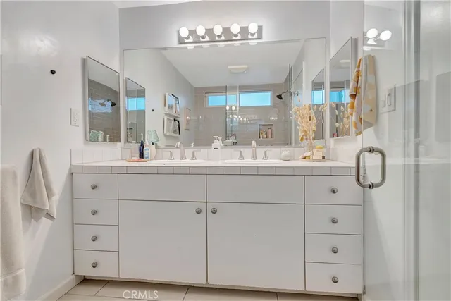 a bathroom with a shower and a sink