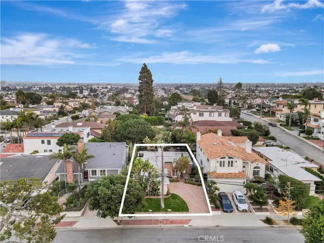 an aerial view of residential building with parking space