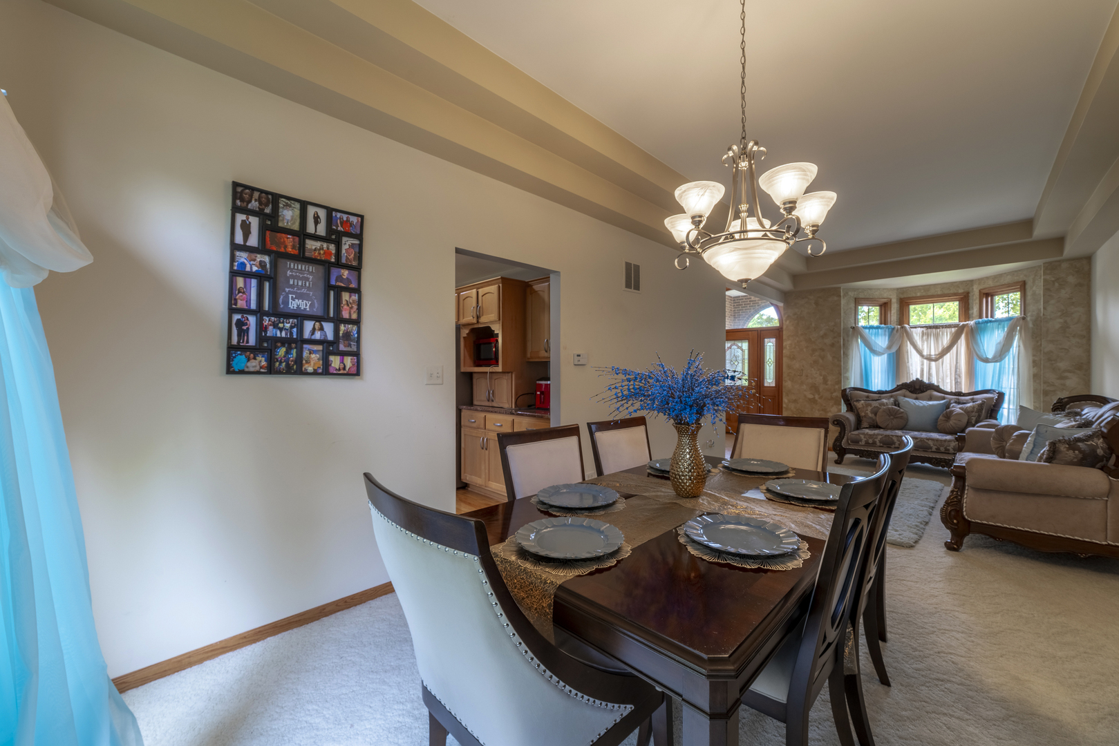 1071 Yamma Ridge New Lenox, IL 60451 - Photo 7 of 51 a view of a dining room with furniture a chandelier and wooden floor