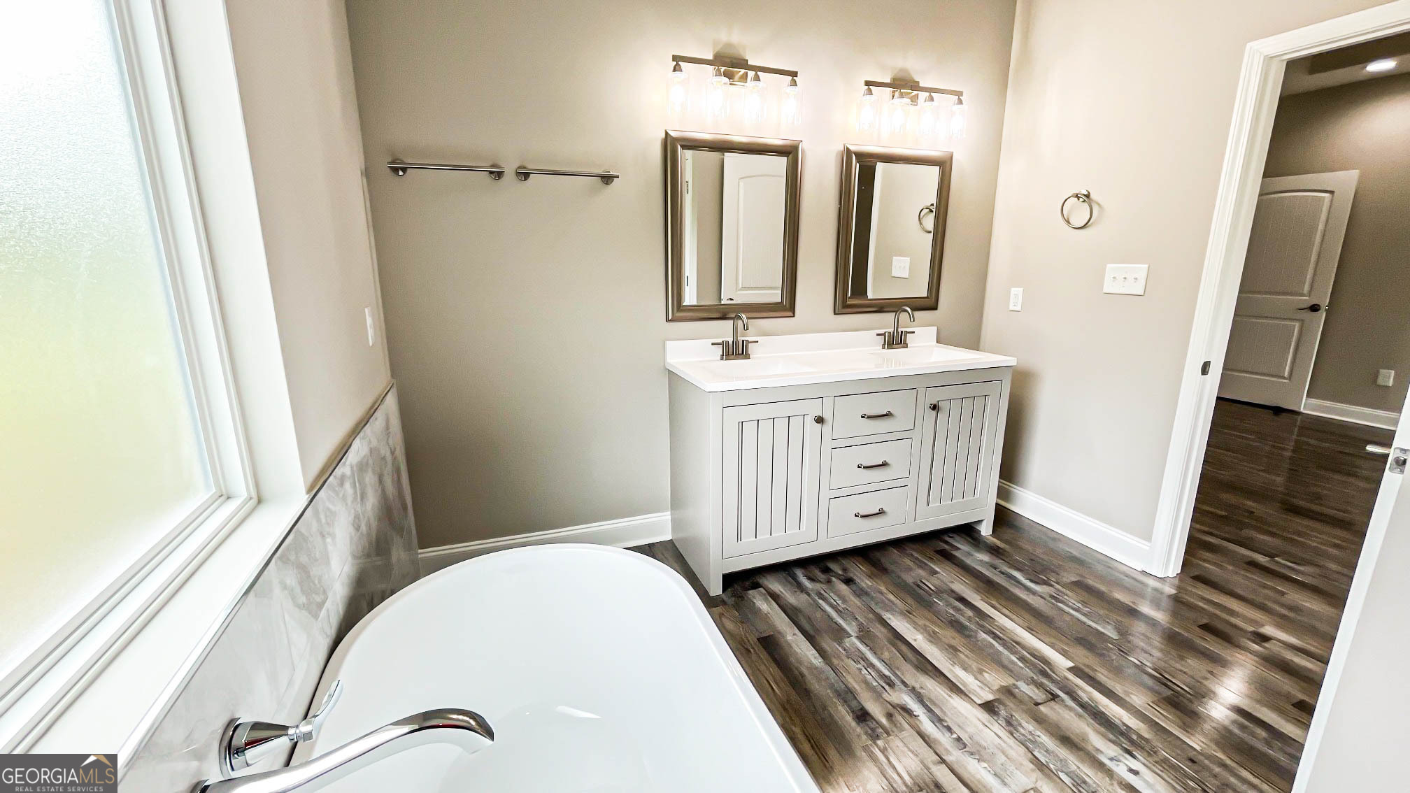 2011 Griffin Road Macon, GA 31216 - Photo 32 of 64 a bathroom with a granite countertop sink toilet a mirror and shower