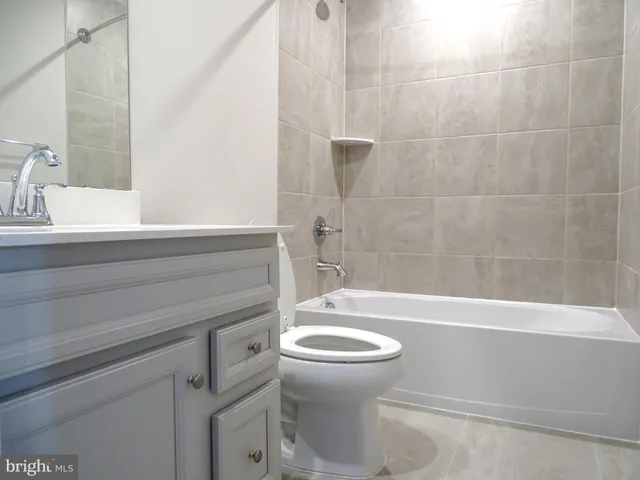 an entryway door with a hallway in the house