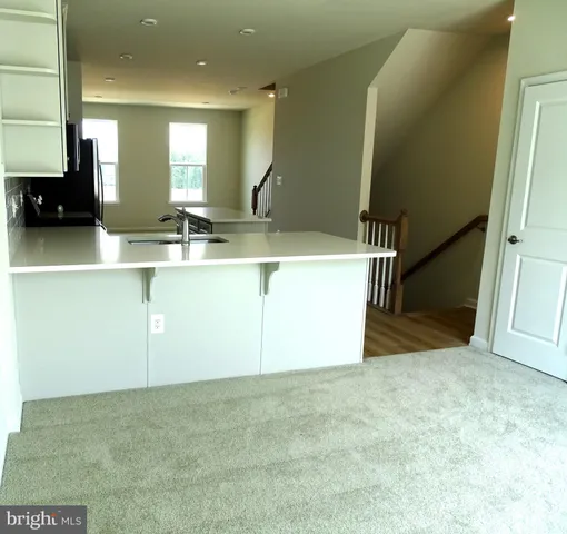 a view of a kitchen with a sink