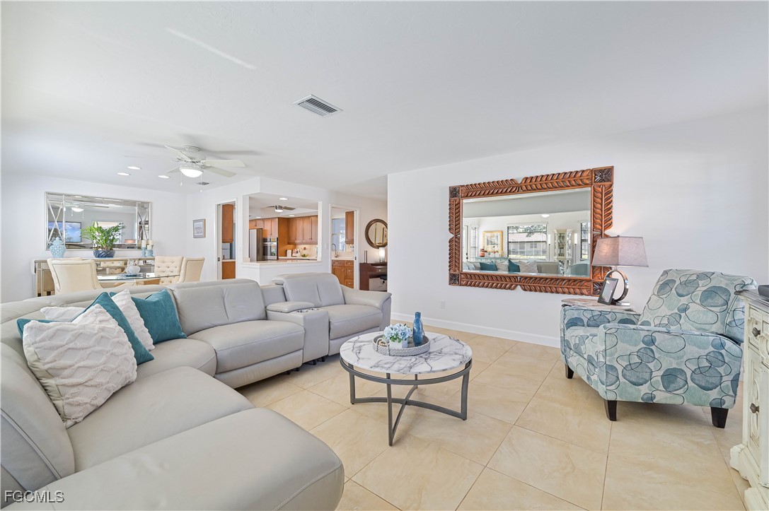 5590 Buring Court Fort Myers, FL 33919 - Photo 13 of 38 a living room with furniture and a wooden floor