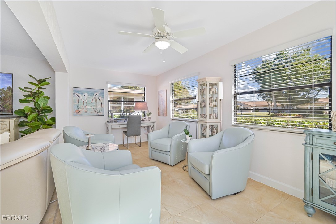5590 Buring Court Fort Myers, FL 33919 - Photo 15 of 38 a living room with furniture and a large window