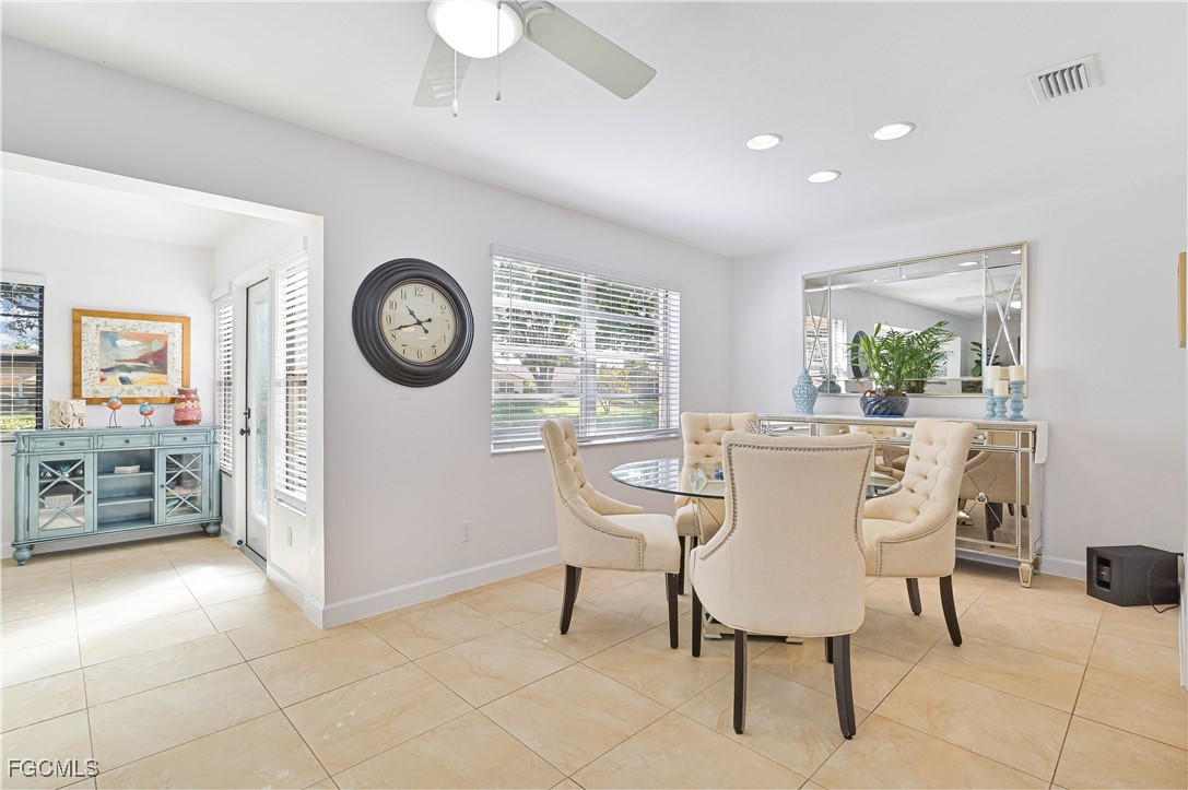 5590 Buring Court Fort Myers, FL 33919 - Photo 16 of 38 a dining room with furniture and window