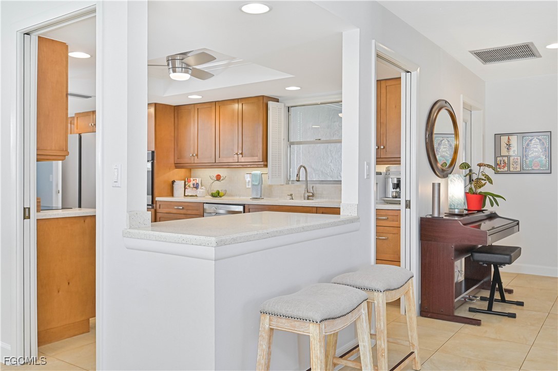 5590 Buring Court Fort Myers, FL 33919 - Photo 18 of 38 a kitchen with a sink cabinets and window
