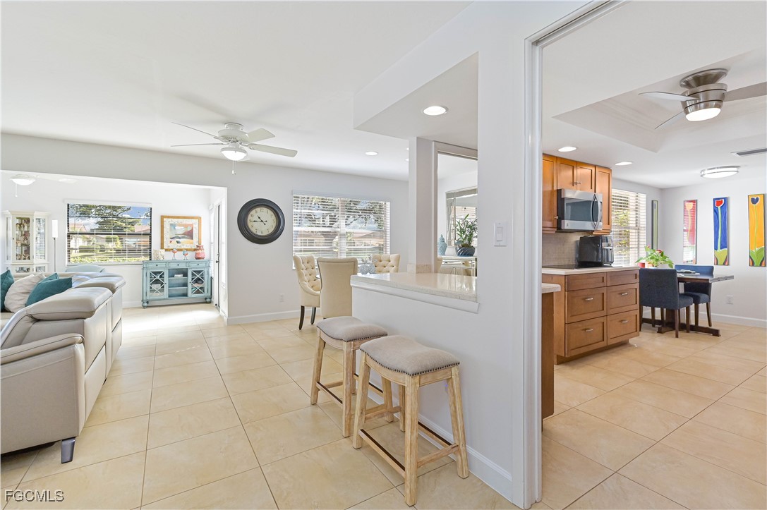 5590 Buring Court Fort Myers, FL 33919 - Photo 19 of 38 a living room with furniture and a large window