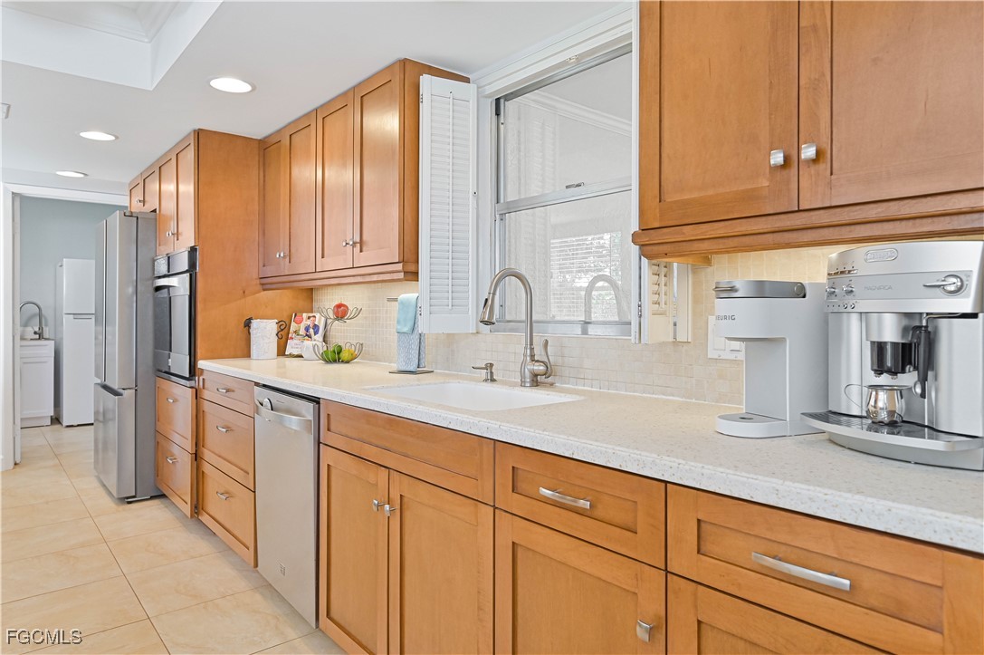 5590 Buring Court Fort Myers, FL 33919 - Photo 20 of 38 a kitchen with cabinets and a sink