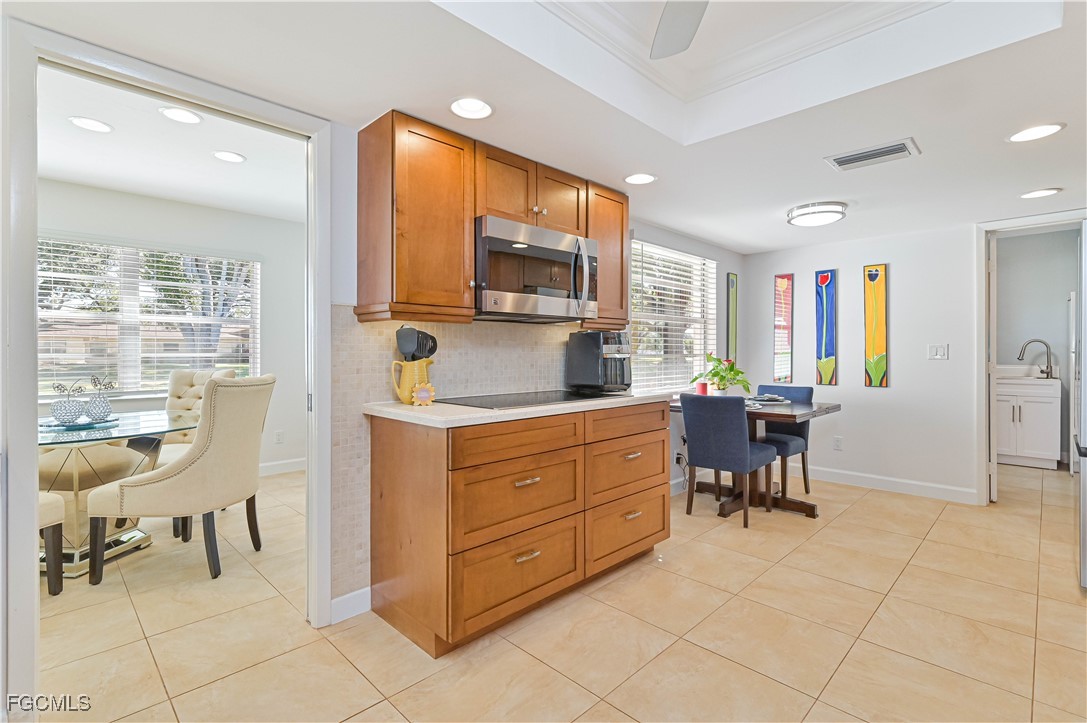 5590 Buring Court Fort Myers, FL 33919 - Photo 21 of 38 a kitchen with a refrigerator and a sink