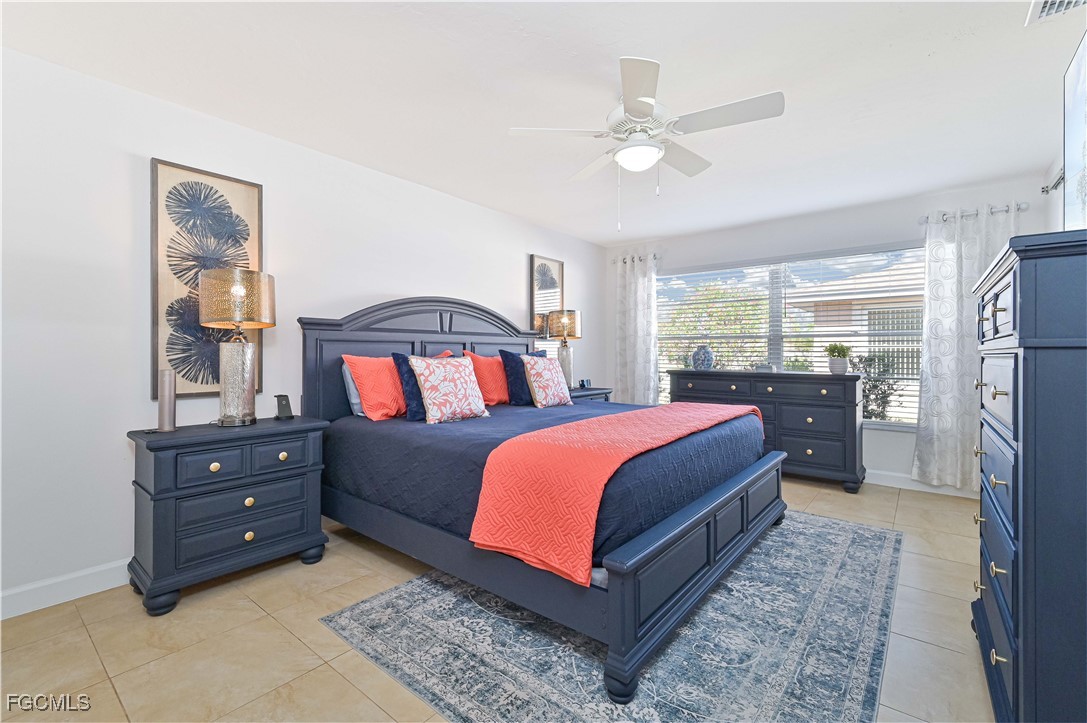 5590 Buring Court Fort Myers, FL 33919 - Photo 30 of 38 a bedroom with a bed and window