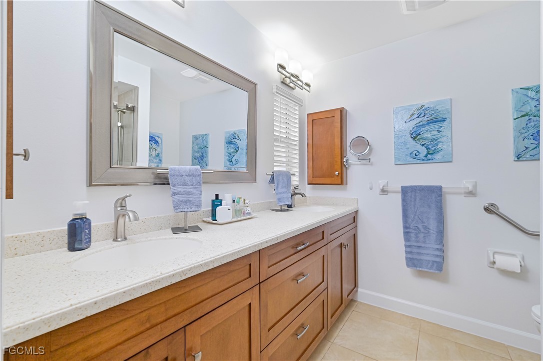 5590 Buring Court Fort Myers, FL 33919 - Photo 33 of 38 a bathroom with a double vanity sink mirror and double